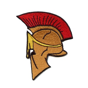 May include: An embroidered patch of a Spartan helmet with a red plume. The helmet is brown with a gold trim.