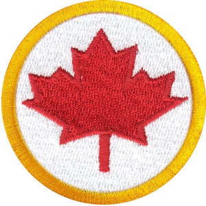 May include: A red maple leaf embroidered on a white circle with a yellow border.