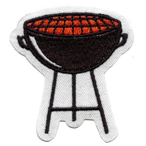 May include: A black and orange embroidered patch of a grill with a round top and three legs.