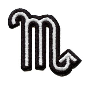 May include: Black and white embroidered iron-on patch of the astrological sign Scorpio.