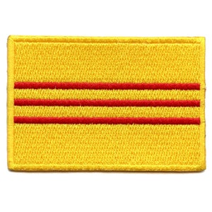 May include: Yellow fabric patch with three red horizontal stripes.