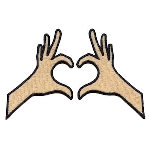 May include: Two hands forming a heart shape with fingers, outlined in black and filled with a light brown color.