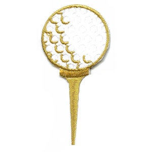 May include: A white golf ball with a gold outline sits on a gold golf tee.