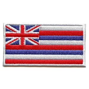 May include: An embroidered patch featuring the flag of Hawaii. The flag is white with eight horizontal stripes of red, blue, and white. The upper left corner features a smaller Union Jack.