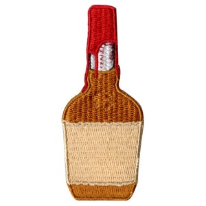 May include: Embroidered patch of a brown glass bottle with a red top. The bottle has a white label.
