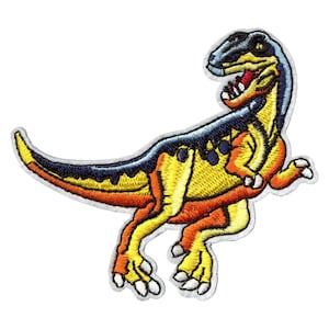 May include: A yellow, orange, and blue embroidered dinosaur patch. The dinosaur is facing right and has its mouth open.
