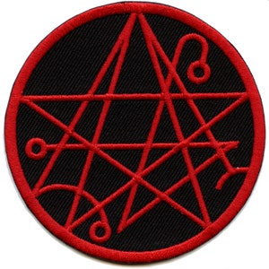 May include: Red embroidered pentagram symbol on a black circular patch.