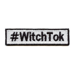 May include: White embroidered patch with black stitching and the text "#WitchTok" on a white background.