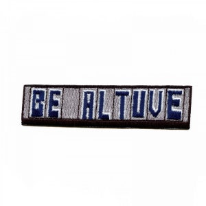 May include: A brown and gray embroidered patch with the text "BE ALTIVE" in blue thread.