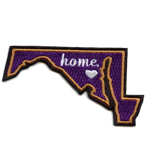 May include: Purple embroidered patch in the shape of the state of Maryland with a gold outline. The text "home" is embroidered in white with a white heart.