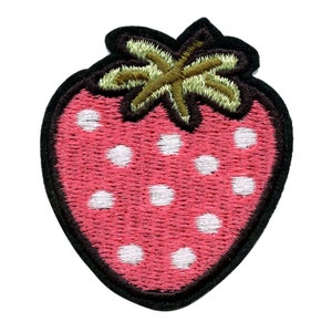 May include: A pink embroidered strawberry with white polka dots and a green embroidered stem. The strawberry is outlined in black.