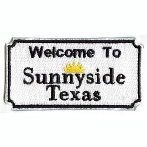 May include: White embroidered patch with black text that reads "Welcome To Sunnyside Texas" with a yellow crown above the word "Sunnyside".