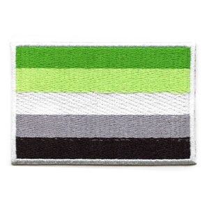 May include: An embroidered patch featuring the agender pride flag. The patch is green, light green, white, grey and black with a white border.