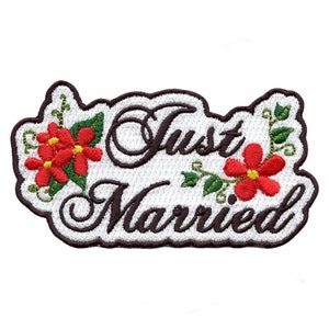 May include: White embroidered patch with brown lettering that reads "Just Married" with red and green floral accents.