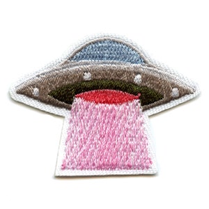 May include: Embroidered iron-on patch of a pink and grey UFO with a red light beaming out of the bottom.