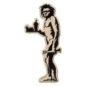 May include: A brown embroidered patch of a caveman holding a tray with a bottle and a piece of food. The caveman is giving the middle finger.