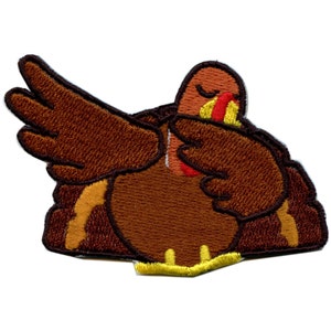 May include: Embroidered patch of a brown turkey performing the dab dance. The turkey has a red wattle and a yellow beak. The patch is ideal for adding a fun touch to clothing, bags, or other items.