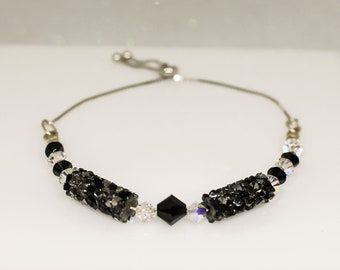 Pulsera tubular de cristal Swarovski, negro metalizado, cadena de plata de ley