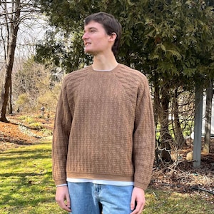 May include: A set of three ceramic vases in varying heights and shapes. The vases feature a matte white finish and a minimalist design, suitable for displaying flowers or as decorative objects. The tallest vase is approximately 10 inches tall.