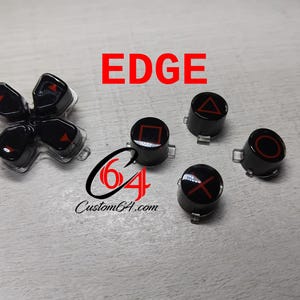 May include: A set of black and red PlayStation controller buttons with the text "EDGE" above them. The buttons are labeled with the standard PlayStation symbols: square, circle, triangle, and cross.