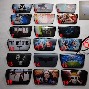 Może przedstawiać: Kolekcja niestandardowych soczewek do okularów przeciwsłonecznych z różnymi grafikami. Projekty obejmują tytuły gier wideo, takie jak "Ghost of Tsushima" i "The Last of Us", postacie z anime i motywy sportowe. Soczewki są ponumerowane.