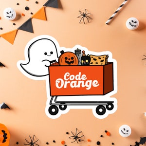 May include: A white ghost pushing a red shopping cart filled with Halloween decorations, including a jack-o-lantern, a black cat, and a candle. The cart has the text "Code Orange" printed on the side.