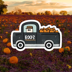 May include: A sticker depicting a black truck with the words "Boo's Pumpkin Patch." The truck's load area is full of orange pumpkins. The background shows a pumpkin field under a sunset sky, with pumpkins scattered on the ground.