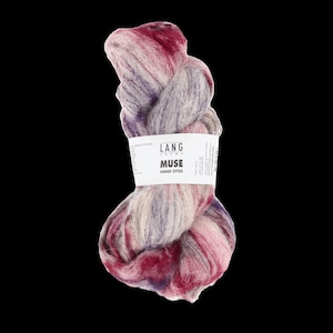 May include: A ball of hand-dyed yarn in pink, purple, and grey hues. The yarn is labelled "MUSE" by LANG FARMS. The colours blend, creating a soft, textured appearance. The yarn is likely used for knitting or crochet projects.
