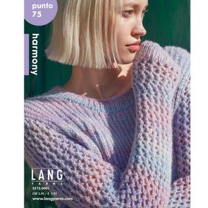 May include: A close-up of a woman wearing a light purple and blue knitted sweater with a lacy pattern. The sweater is made with a soft yarn and has a relaxed fit. The text "LANG Yarns 2575.0001 CHF 5.90 / € 5.95 www.langyarns.com" is printed on the bottom of the image.