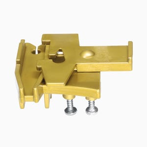 May include: Gold-coloured metal electrical connector with two screws. The connector has a unique design with a hinged section and a protruding arm.
