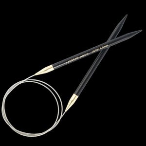 May include: Black Lantern Moon US10/6.0mm circular knitting needles. The needles have gold-coloured tips and are connected by a flexible white cable. The text "LANTERN MOON US10/6.0mm" is printed on the black needle.