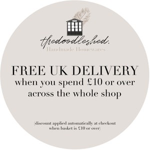 May include: A white circle with a gray background and black text that says "thedoodleshed. Handmade Homewares FREE UK DELIVERY when you spend &pound;10 or over across the whole shop (discount applied automatically at checkout when basket is &pound;10 or over)"