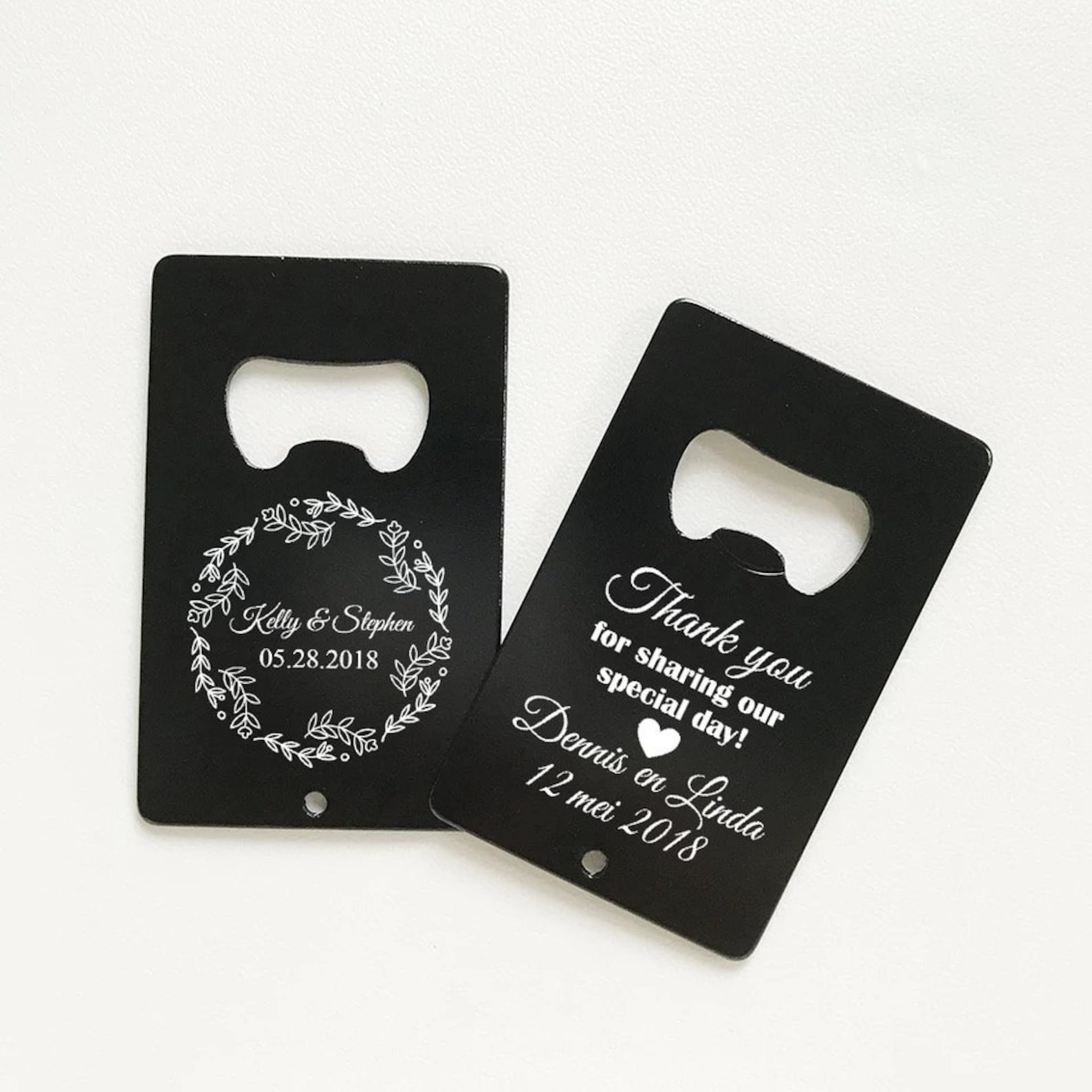 This personalized credit card bottle opener is made of durable black stainless steel and engraved with a white imprint.