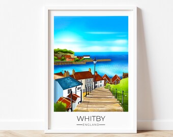 Puede incluir: Una impresión artística enmarcada de Whitby, Inglaterra, con una escena costera. La obra de arte representa una escalera de piedra que conduce al puerto, con edificios y un cielo azul brillante. La palabra "WHITBY" está impresa en la parte inferior.