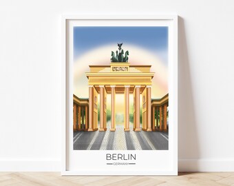 May include: Framed art print featuring a detailed illustration of the Brandenburg Gate in Berlin, Germany. The artwork showcases the iconic landmark in a golden hue, with a blue sky and the text "BERLIN - GERMANY" at the bottom.