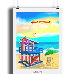 May include: A colorful Miami beach scene print. A lifeguard station with red, white, and blue stripes stands on a sandy beach. A red biplane pulls a banner across a blue sky. A green umbrella and beach chair are on the sand. The word "MIAMI" is at the bottom.
