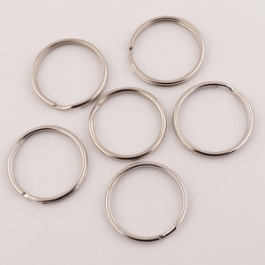 May include: Six silver key rings of different sizes.