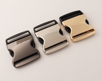 May include: Three plastic buckle closures in different finishes: silver, gold, and gunmetal. The buckles are designed for use with webbing or straps.