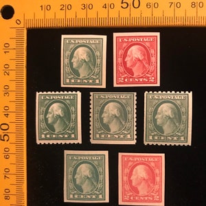 May include: A collection of six vintage US postage stamps featuring a profile of George Washington. The stamps are in various shades of green and red, with denominations of 1 cent and 2 cents.
