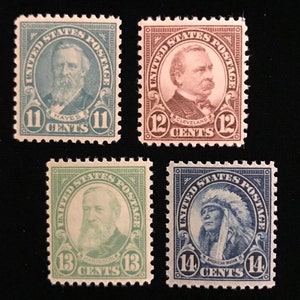 May include: Four vintage United States postage stamps featuring portraits of presidents Rutherford B. Hayes, Grover Cleveland, Benjamin Harrison, and an American Indian. The stamps are in denominations of 11, 12, 13, and 14 cents.