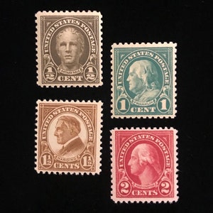 May include: Four vintage United States postage stamps featuring portraits of Nathan Hale, Benjamin Franklin, Warren G. Harding, and George Washington. The stamps are in denominations of 1/2 cent, 1 cent, 1 1/2 cents, and 2 cents.