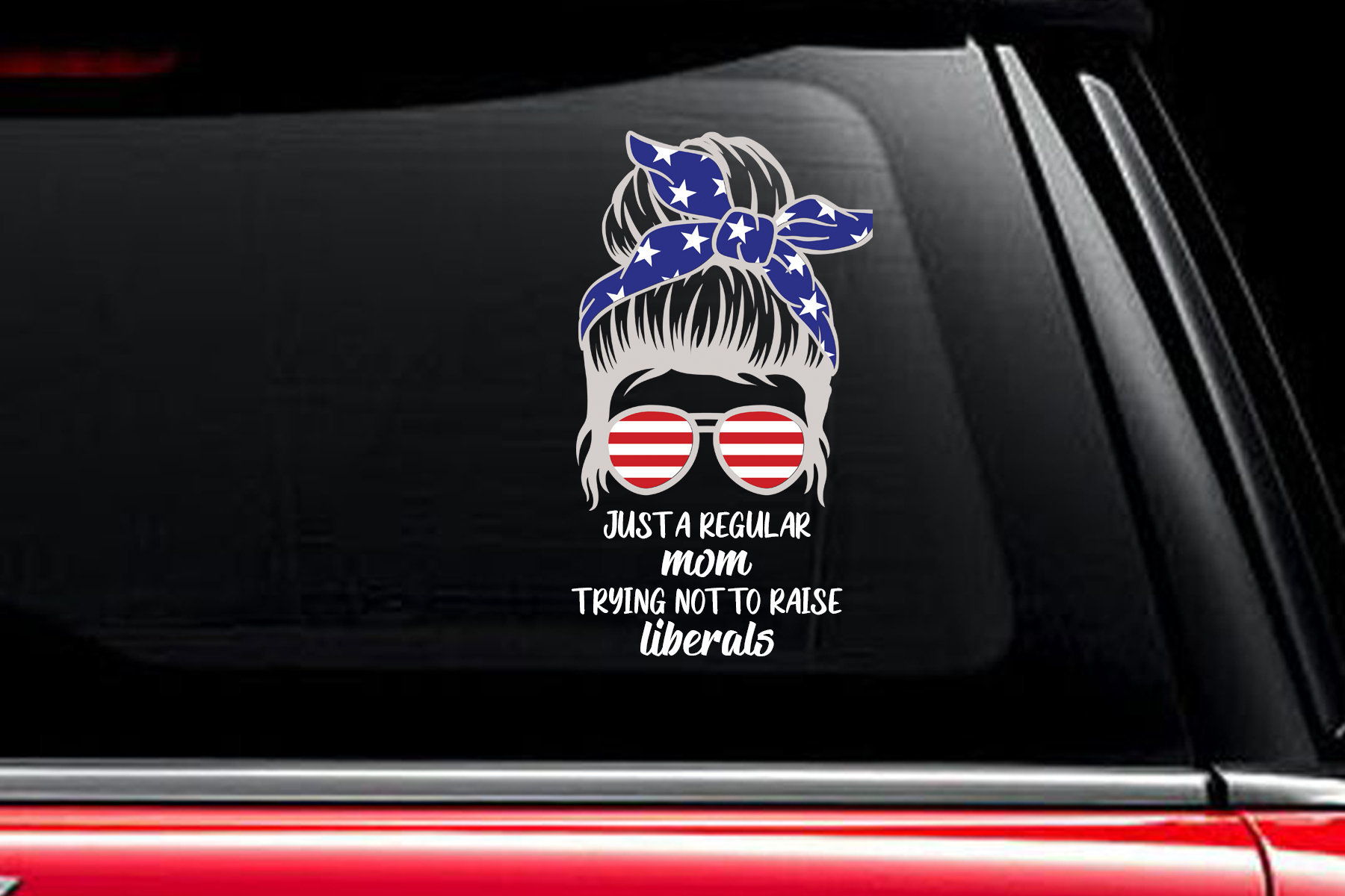 Just a regular mom trying not to raise liberals decal