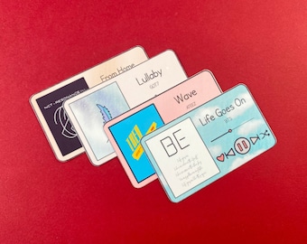 May include: Four colorful stickers with the titles "NCT-RESONANCE", "From Home", "Lullaby", "Wave", "BE", "Life Goes On" and the names of the artists "GOT7", "ATEEZ", "BTS".