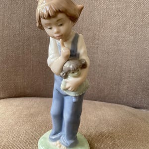 Vintage NAO by Lladro Figurine of Girl in Dungarees Holding her Doll - Unboxed - 8 ins h - yr. 1988