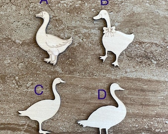 May include: Four wooden cutout geese, each with a different pose. The geese are unpainted and ready to be decorated.