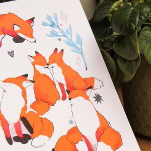 May include: A white background with five orange foxes in different poses. The foxes are drawn in a cartoon style with black outlines. There are blue and white floral elements and white stars scattered throughout the image.