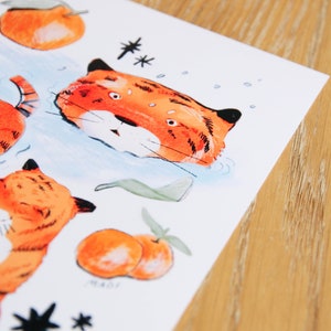 May include: A sheet of stickers featuring orange fruit, green leaves, and orange and black tigers. The stickers are on a white background.