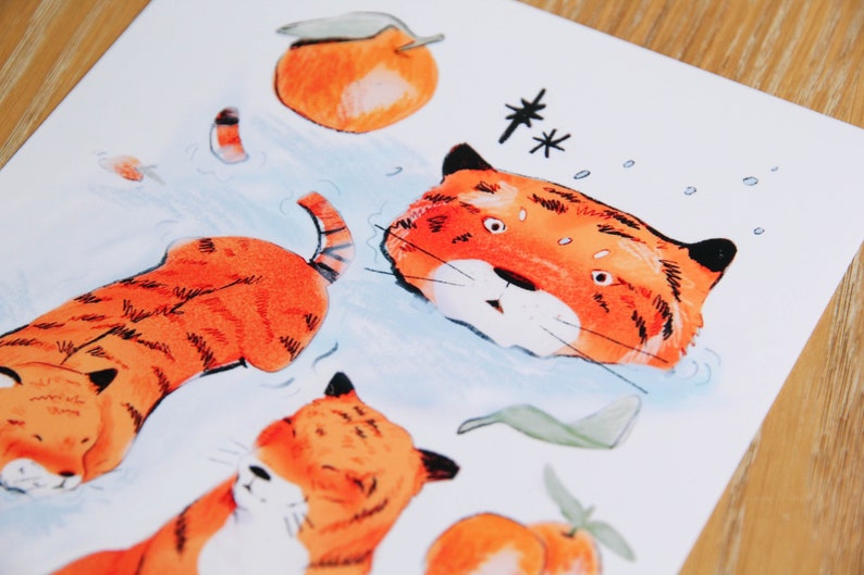 May include: A watercolour illustration of a tiger with orange and black stripes. The tiger is swimming in water with bubbles around it. There are also orange fruits with green leaves in the image.