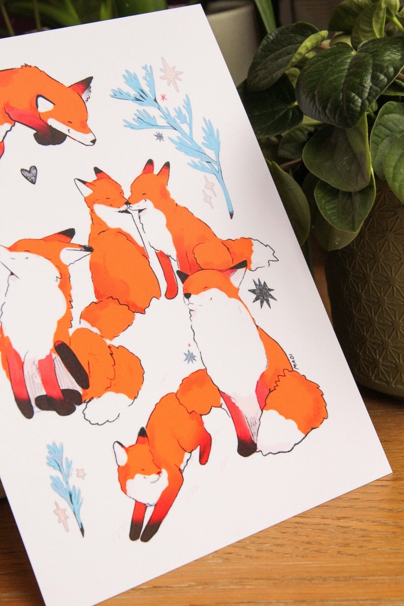 May include: A white background with five orange foxes in different poses. The foxes are drawn in a cartoon style with black outlines. There are blue and white floral elements and white stars scattered throughout the image.