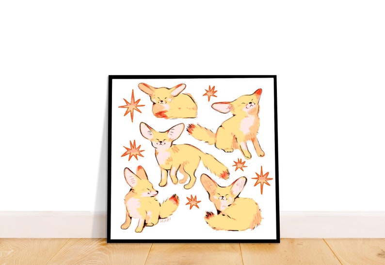 May include: A white background with a black frame around a print of five yellow fennec foxes with orange accents. The foxes are in different poses and are surrounded by orange stars.